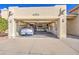 Garage interior with a car, cabinets, and workspace at 26409 S Moonshadow Dr, Sun Lakes, AZ 85248