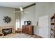 Cozy living room featuring a fireplace and view to a patio at 26409 S Moonshadow Dr, Sun Lakes, AZ 85248