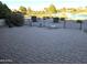 Brick paved patio overlooks a lake and golf course at 26409 S Moonshadow Dr, Sun Lakes, AZ 85248