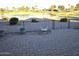 Brick paved patio overlooks a lake and golf course at 26409 S Moonshadow Dr, Sun Lakes, AZ 85248