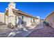 Back patio with seating area and desert landscaping at 26409 S Moonshadow Dr, Sun Lakes, AZ 85248