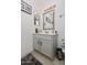 Bathroom with vanity, mirror, and light grey cabinets at 2697 W Ocotillo Rd, Phoenix, AZ 85017