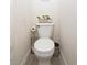 Clean and well-maintained half bathroom with toilet and storage at 2697 W Ocotillo Rd, Phoenix, AZ 85017