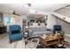 Living room with gray sofa and teal armchairs at 2697 W Ocotillo Rd, Phoenix, AZ 85017