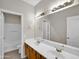 Double vanity bathroom with wood cabinets and mirrors at 2706 N 115Th Dr, Avondale, AZ 85392