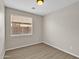 Simple bedroom with wood-look flooring at 2706 N 115Th Dr, Avondale, AZ 85392