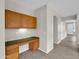 Built-in desk with wood cabinets and granite countertop at 2706 N 115Th Dr, Avondale, AZ 85392