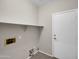 Laundry room with built-in shelving at 2706 N 115Th Dr, Avondale, AZ 85392