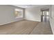 Bright living room featuring light wood-look floors and neutral walls at 2706 N 115Th Dr, Avondale, AZ 85392