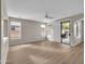 Bright living room with wood-look floors and sliding glass doors at 2706 N 115Th Dr, Avondale, AZ 85392