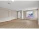 Living room with wood-look floors, neutral walls, and a built-in niche at 2706 N 115Th Dr, Avondale, AZ 85392