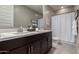 Bathroom with double vanity and walk-in shower at 2707 N Acacia Way, Buckeye, AZ 85396