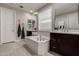 Elegant bathroom with double vanities and a soaking tub at 2707 N Acacia Way, Buckeye, AZ 85396