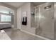 Spa-like bathroom with a large shower and a soaking tub at 2707 N Acacia Way, Buckeye, AZ 85396