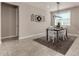 Charming dining room with a farmhouse table and stylish light fixture at 2707 N Acacia Way, Buckeye, AZ 85396