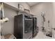 Laundry room with washer, dryer and shelving at 2707 N Acacia Way, Buckeye, AZ 85396