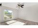 Well-lit bedroom featuring a ceiling fan and a large window offering a view at 2728 E Encanto Cir, Mesa, AZ 85213