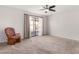 Spacious bedroom with sliding glass doors and a ceiling fan at 2728 E Encanto Cir, Mesa, AZ 85213