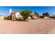 Ranch house with a tree in front and a gravel yard at 2728 E Encanto Cir, Mesa, AZ 85213