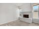 Living room features a fireplace and large windows with natural light at 2728 E Encanto Cir, Mesa, AZ 85213