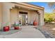 Inviting front entry with covered porch and terracotta pots at 27506 N Montana Dr, Rio Verde, AZ 85263