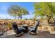 Inviting patio features fire pit and comfortable seating area at 27506 N Montana Dr, Rio Verde, AZ 85263