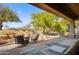 Spacious covered patio with fire pit and comfortable seating at 27506 N Montana Dr, Rio Verde, AZ 85263