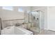 Modern bathroom with a large shower and a soaking tub at 29512 N Tarragona Dr, Peoria, AZ 85383