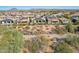 Aerial view of community with homes and desert landscape at 29512 N Tarragona Dr, Peoria, AZ 85383