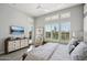 Serene main bedroom with a king-size bed and access to a balcony at 29512 N Tarragona Dr, Peoria, AZ 85383