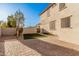 Artificial turf backyard with a brick patio and a view of the mountains at 3040 N Point Ridge Rd, Buckeye, AZ 85396