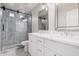 Bathroom with double vanity, marble tile and walk in shower at 3040 N Point Ridge Rd, Buckeye, AZ 85396