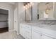 Double vanity bathroom with marble countertop and hexagon tile floor at 3040 N Point Ridge Rd, Buckeye, AZ 85396