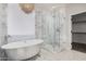 Elegant bathroom with soaking tub, walk-in shower, and marble tile at 3040 N Point Ridge Rd, Buckeye, AZ 85396