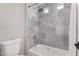 Bathroom with shower/tub combo and marble tile at 3040 N Point Ridge Rd, Buckeye, AZ 85396