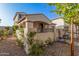 House with stucco siding, a covered entryway and landscaping at 3040 N Point Ridge Rd, Buckeye, AZ 85396