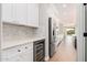 Well-equipped kitchen boasting a wine cooler and ample counter space at 3040 N Point Ridge Rd, Buckeye, AZ 85396