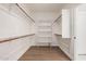 Large walk-in closet with built-in shelving and hanging rods at 3040 N Point Ridge Rd, Buckeye, AZ 85396