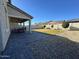 Spacious backyard with patio and grassy area at 3094 N 195Th Dr, Buckeye, AZ 85396