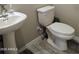 Clean bathroom with white sink and toilet at 3094 N 195Th Dr, Buckeye, AZ 85396