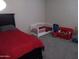 Bedroom with a toddler bed and toys at 3094 N 195Th Dr, Buckeye, AZ 85396