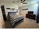 Bedroom with a double bed, dresser, and TV at 3094 N 195Th Dr, Buckeye, AZ 85396