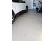 Garage with epoxy flooring and a vehicle at 3094 N 195Th Dr, Buckeye, AZ 85396