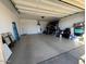 Large garage with extra storage space and flooring at 3094 N 195Th Dr, Buckeye, AZ 85396