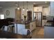 Modern kitchen with stainless steel appliances and island at 3094 N 195Th Dr, Buckeye, AZ 85396