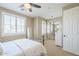 Bright bedroom with mirrored closet doors and a comfy bed at 3151 E Turnberry Dr, Gilbert, AZ 85298