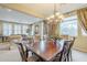 Formal dining room with a chandelier and wooden table at 3151 E Turnberry Dr, Gilbert, AZ 85298