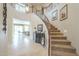 Beautiful entryway showcasing a curved staircase and views to the living room at 3151 E Turnberry Dr, Gilbert, AZ 85298