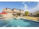 Two-story house with a refreshing blue pool and spacious backyard at 3151 E Turnberry Dr, Gilbert, AZ 85298