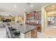 Spacious kitchen with granite countertops, stainless steel appliances, and rich wood cabinetry at 3151 E Turnberry Dr, Gilbert, AZ 85298